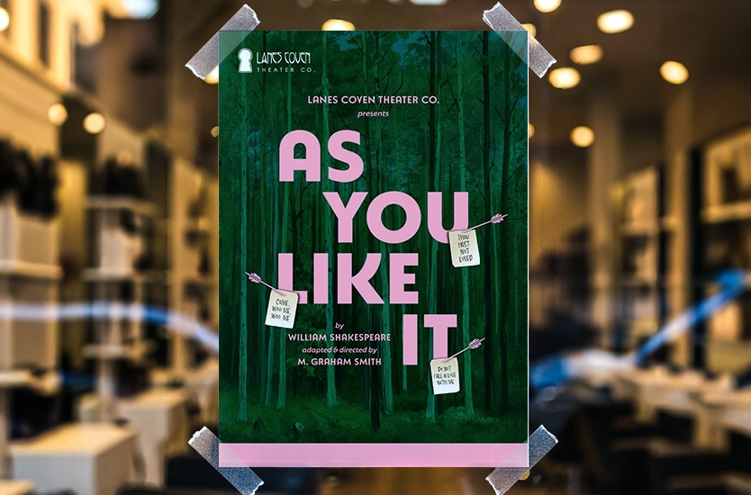 A storefront window with a flyer promoting William Shakespeare's As You Like It